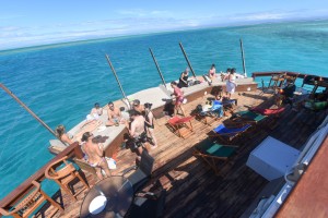 On a bar island Cloud 9's deck guests chilling and socializing