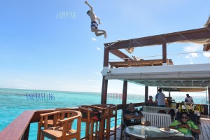On Cloud 9 guests enjoying differents activities jumping snorkeling sleeping and relaxing
