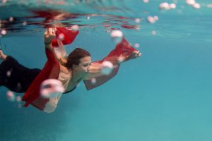 woman swimming underwater in Fiji
