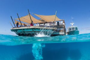 someone dived in the water at Cloud 9 in Fiji by Anais Photography