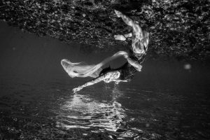 Black and white and upside down woman underwater in Fiji by Anais Photography
