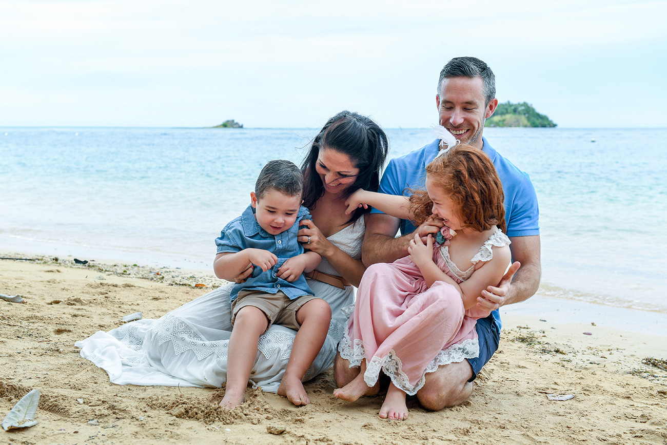 Cute family poses for a photoshoot at Malolo Island Resort Fiji