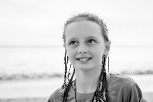 Black and white picture of caucasian girl in braids
