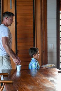 Father and son leave the breakfast table during Fiji family vacation