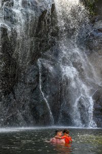 Waterfall against rocks in Fiji family photoshoot
