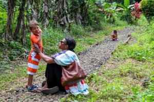 Mom soothes crying son in Fiji