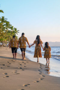 The family strolls into the ocean at Double Tree Hilton