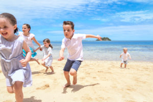 The grandchildren race on the yellow sand beaches at Malolo Island Resort