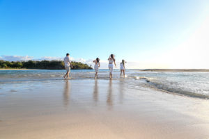 A family runs on Natadola beach