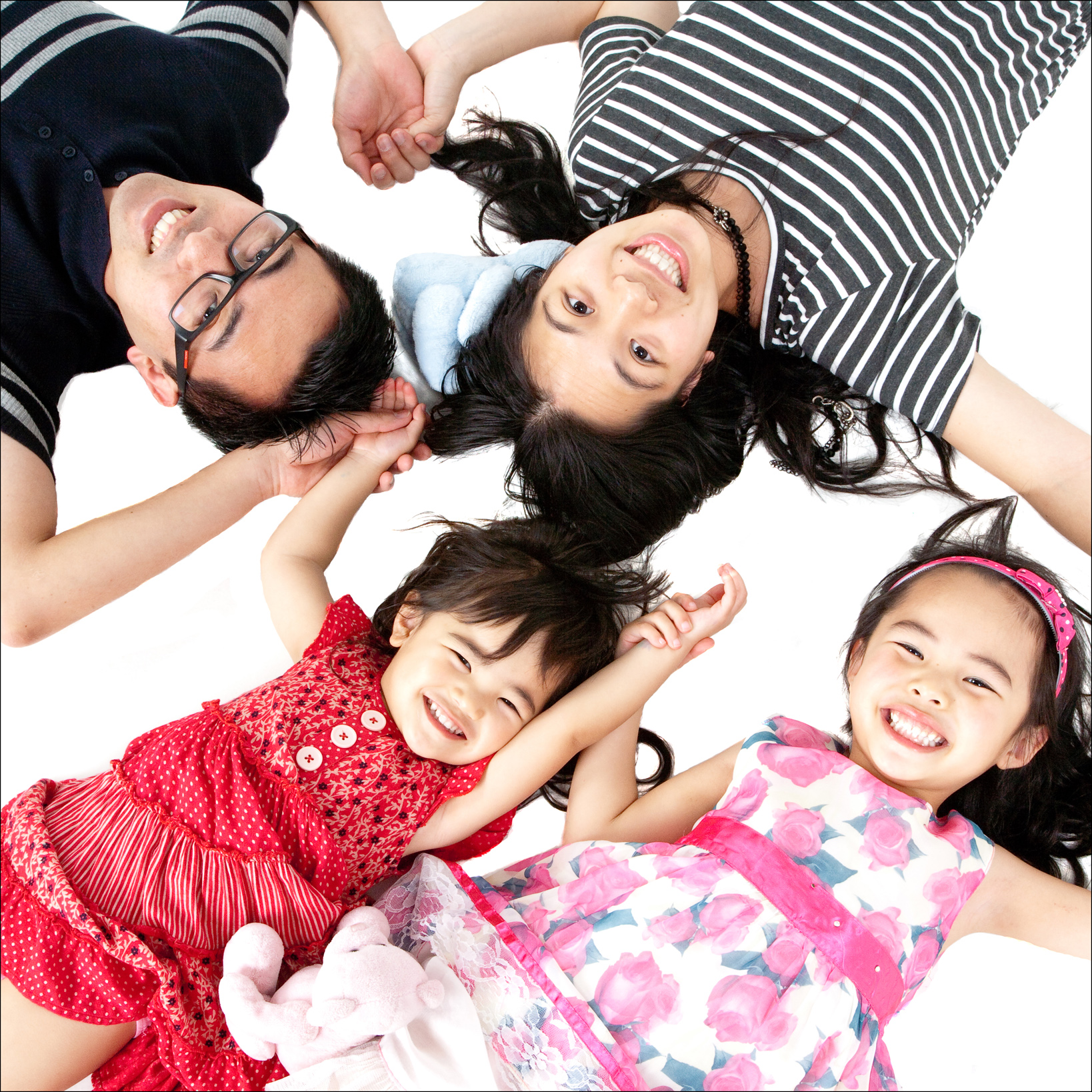 Portrait of an asian family from above professional studio photography by Anais Chaine in Auckland Ponsonby New Zealand
