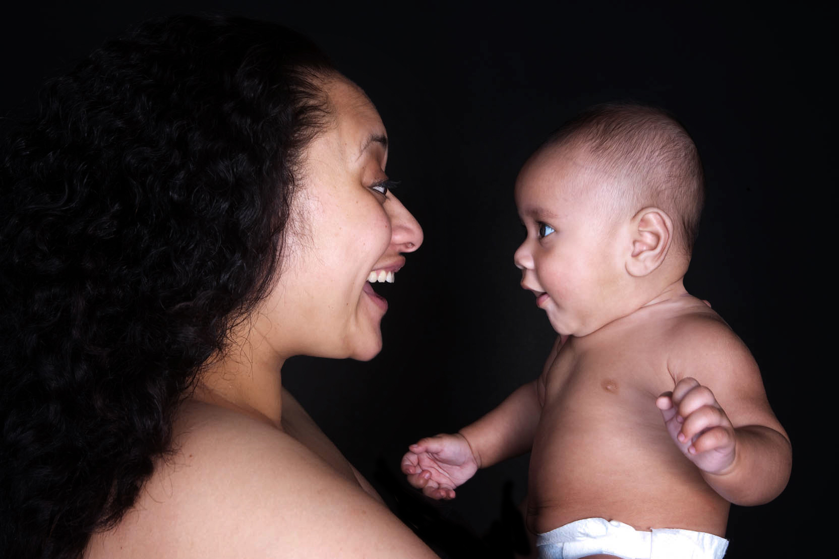 Baby boy staring at his mum smiling professional studio photography by Anais Chaine in Auckland Ponsonby New Zealand