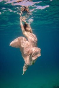 Bride underwater for her photoshoot