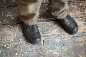 Feet and stains in the floor Henri Castella's workroom in Lyon, Fance. French painter.