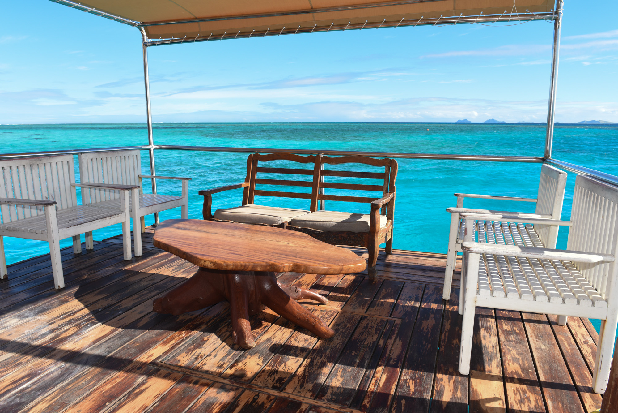 Fiji Beautiful living room on a boat with impressive turquoise sea in the background