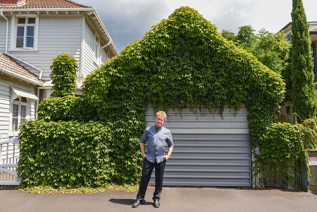 Don McGlashan in front of his garage covered with ivy