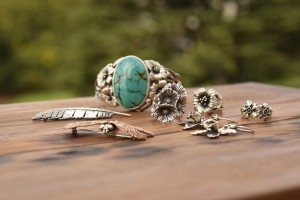 Silver jewelry setting down on a wooden table