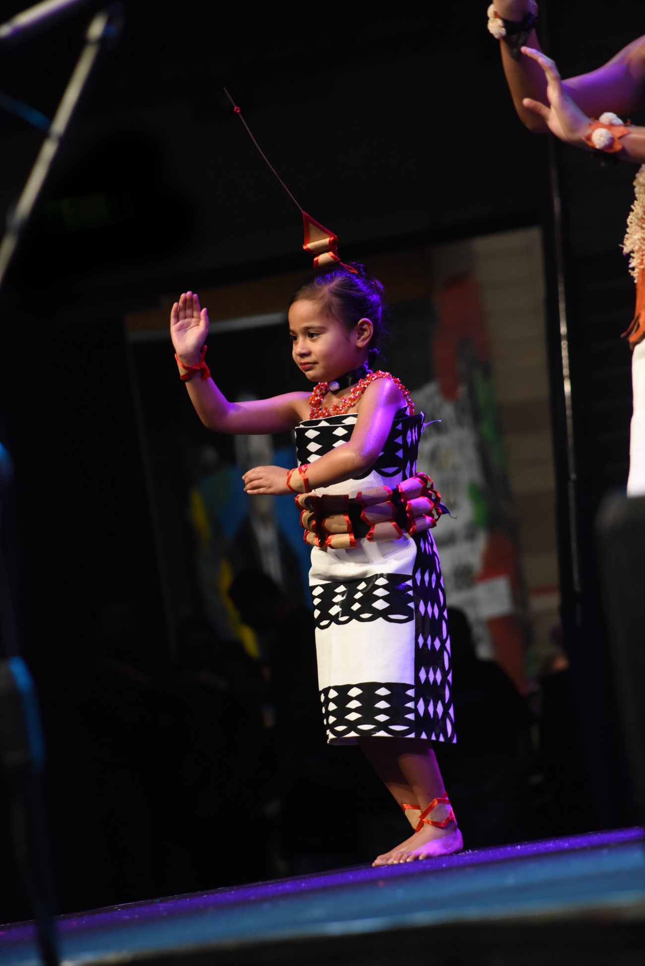 A young girl dancing proudly her traditional Fiji dance