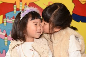 Sisters kissing eachothers