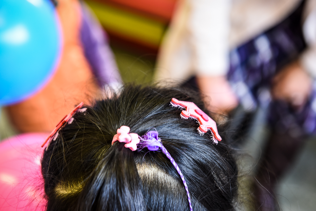 Little girl with brooches on her hair