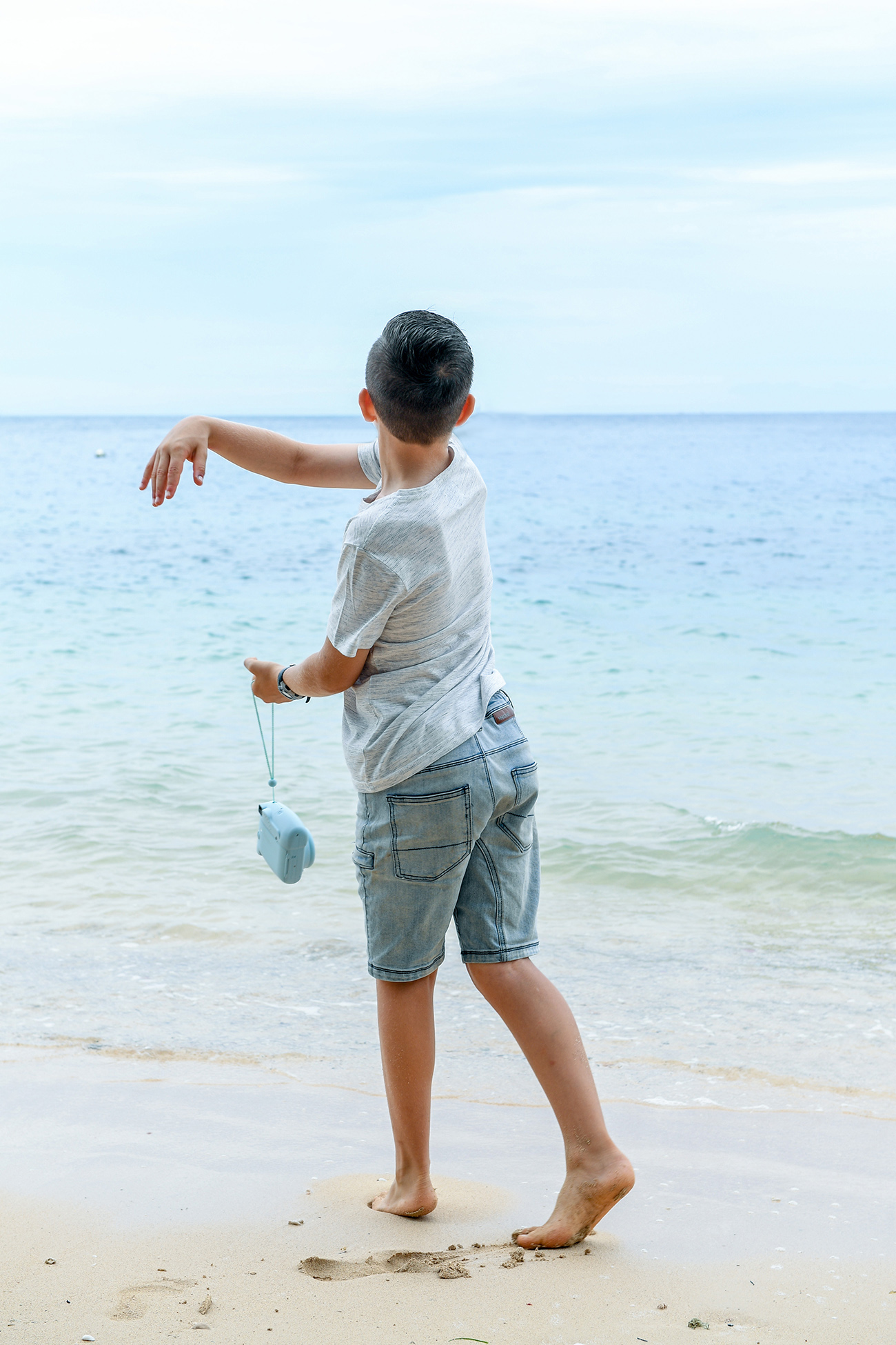 Boy by ocean in Malolo Island Resort Fiji