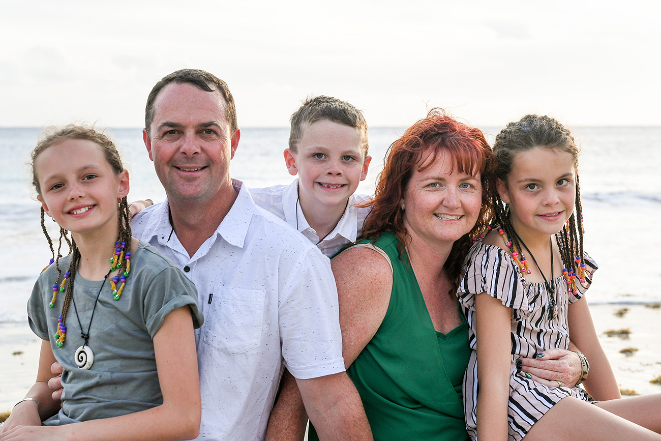 Closeup of mum, dad and children in beach family photoshoot Fiji