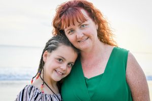 Red haired mum and daughter pose for family photoshoot in Fiji