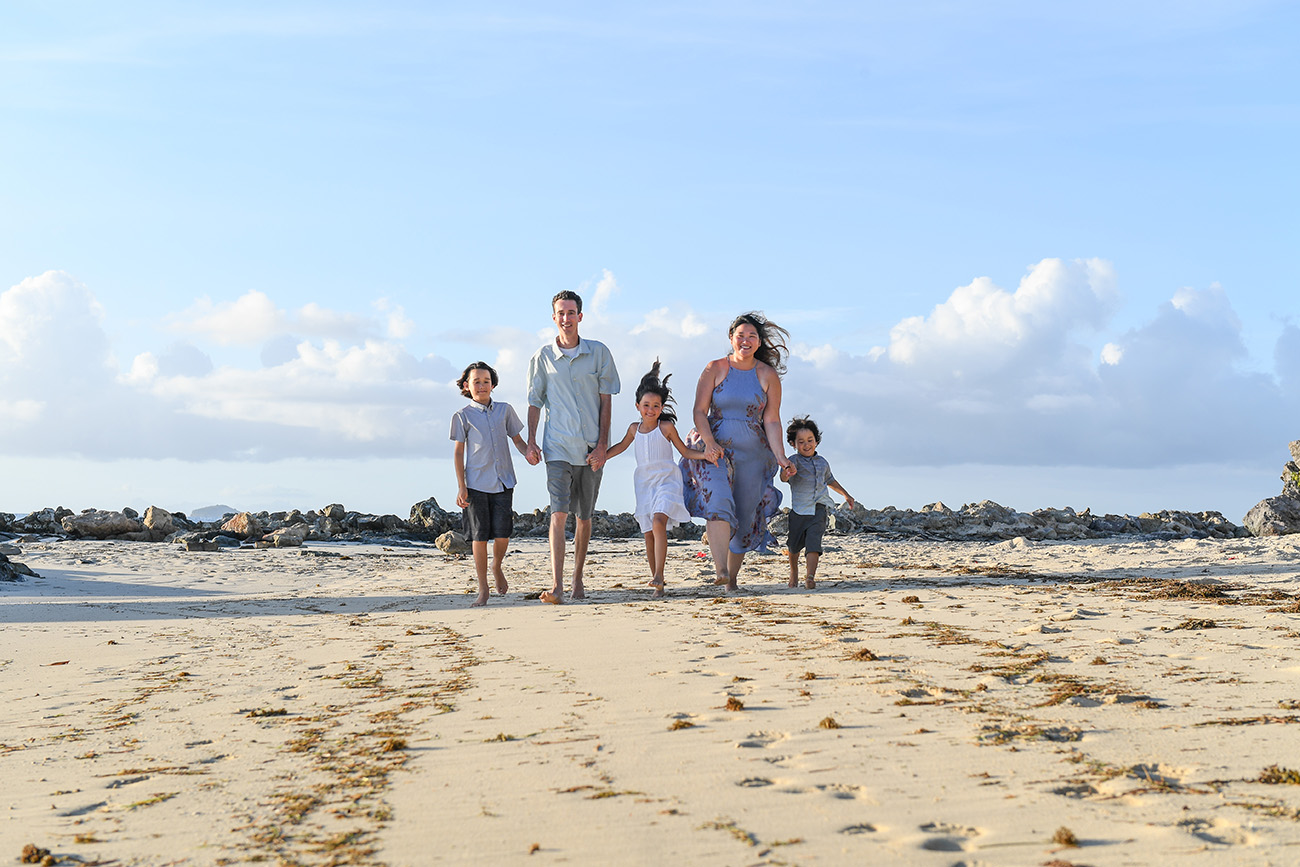 Wideshot of family on Fiji beach in family photoshoot