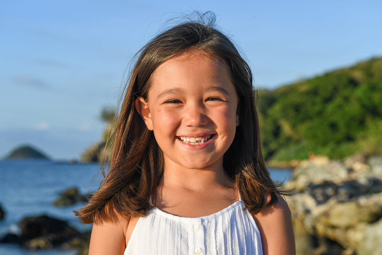 Stunning smile by cute brunette girl in family photoshoot Fiji