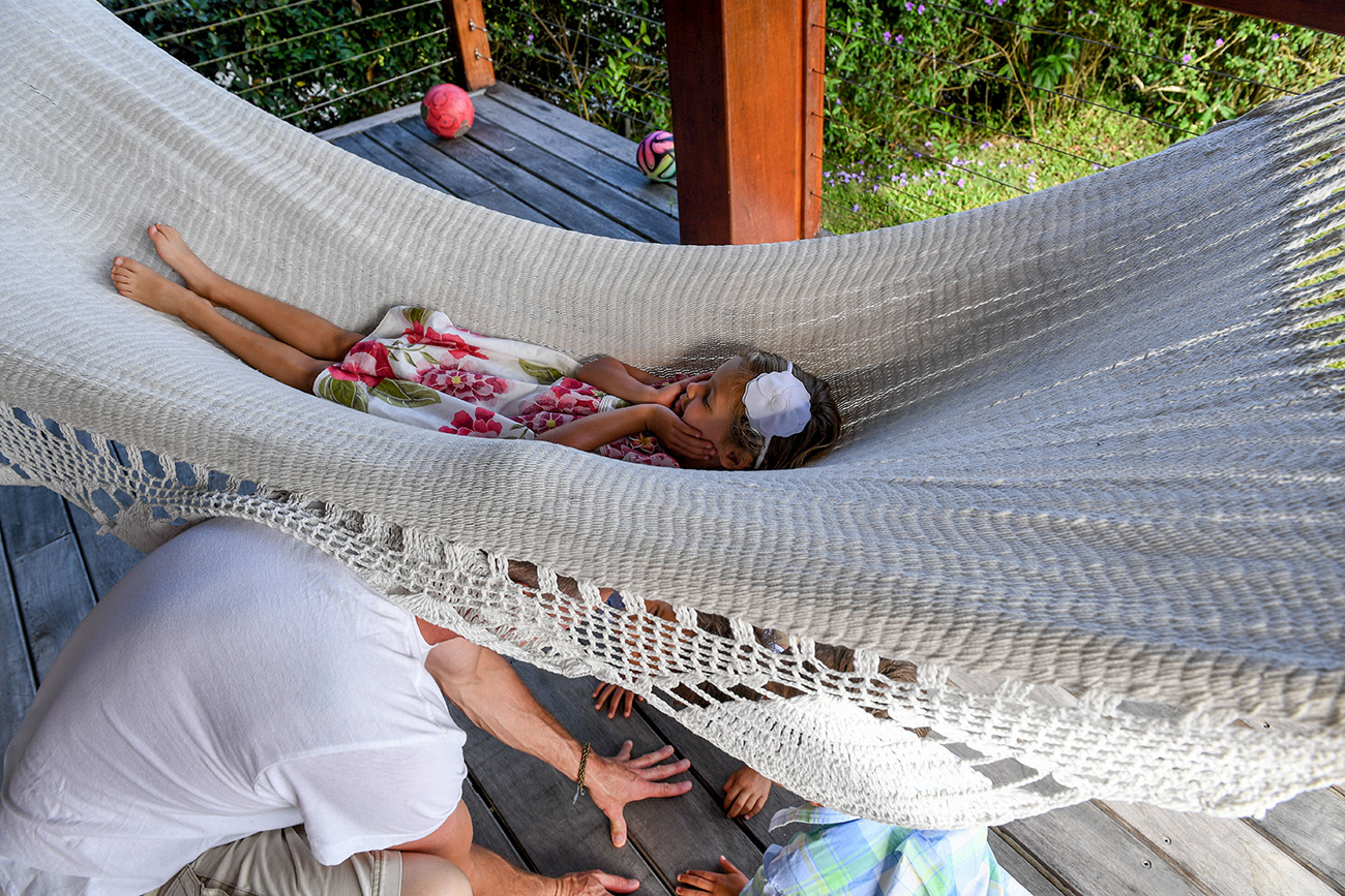 Triplets flip dad over on hammock during Fiji family vacation