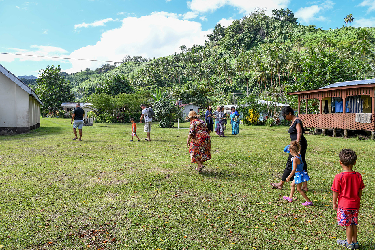 Family walk in Fiji villages at family vacation in Fiji