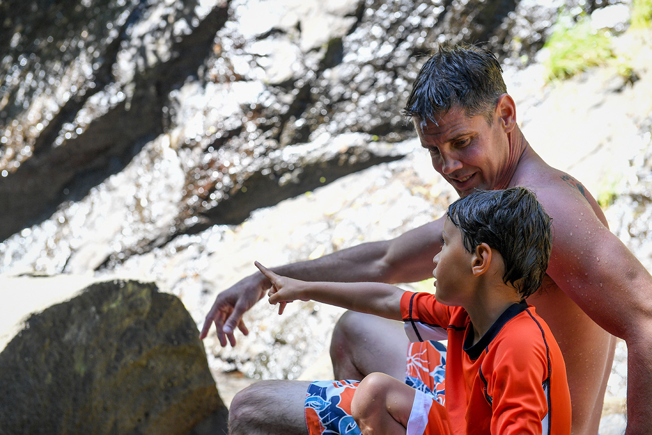 Dad and son bond on the rocks in Fiji