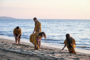 The family collects seashells on the beach at Double Tree Hilton Fiji