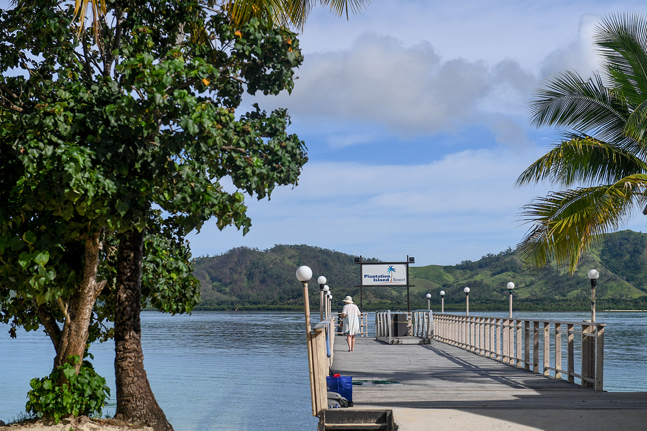 Grandma strolling on the docks of plantation Island Resort Fiji