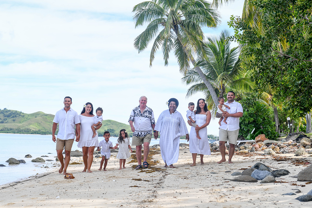 All white family portrait on the shores of Plantation Island Resort Fiji