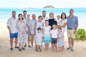 The entire extended family pose for a group family photo at Malolo Island Resort