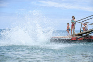 The family lands into the water with a big splash