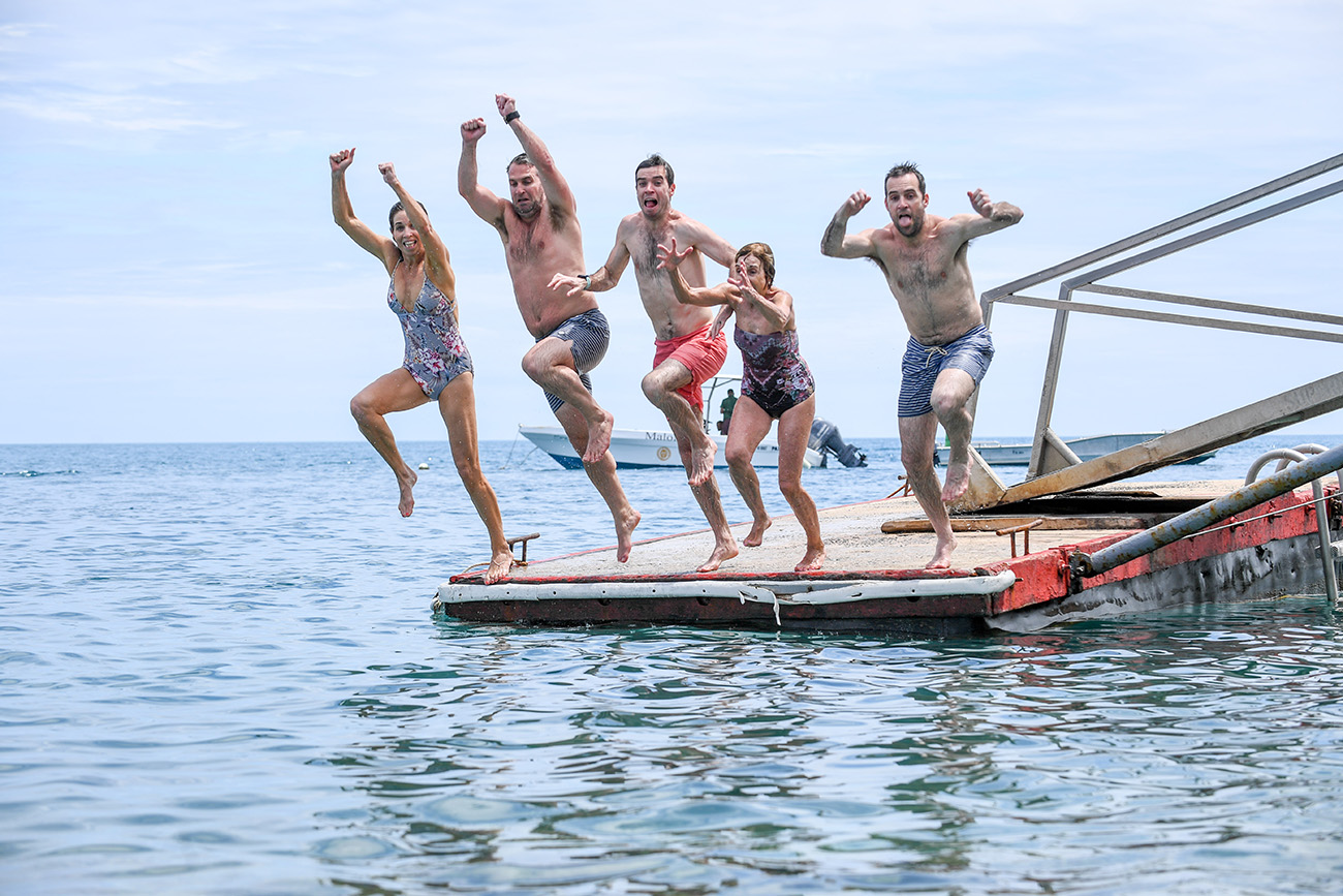 The entire family leaps from the dock to make a gigantic water bomb