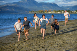 Cousins run on the beach at Denarau Fiji