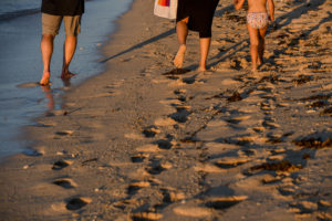 The family leaves footprints in the sand