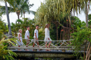 Family walking on the bridge at the Outrigger during the photoshoot
