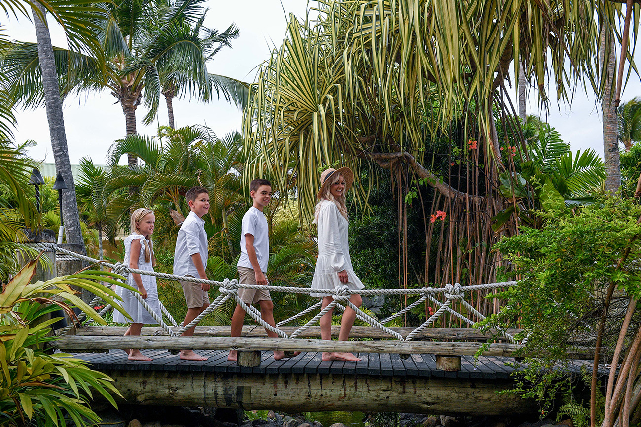 Family walking on the bridge at the Outrigger during the photoshoot