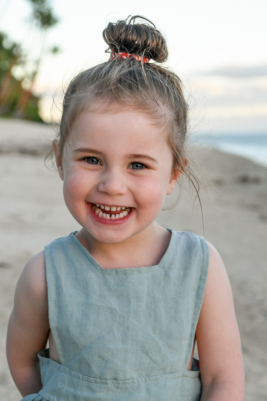 candid portrait of a girl smiling at sunset in Fiji